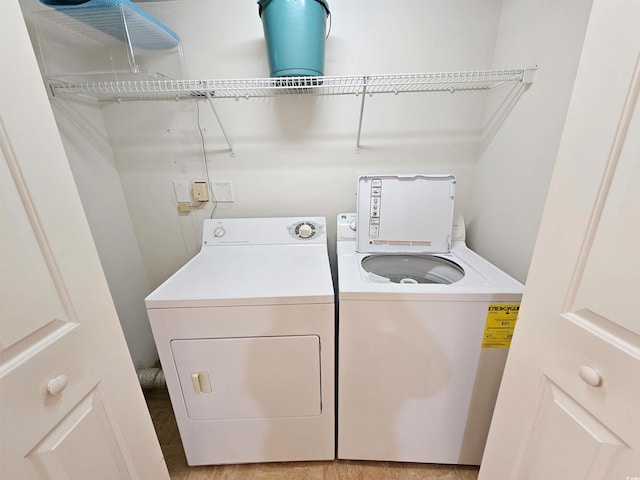 8560 Queensway Blvd Unit 508, Myrtle Beach, SC 29572 - laundry room featuring washer and clothes dryer and light wood-style floors