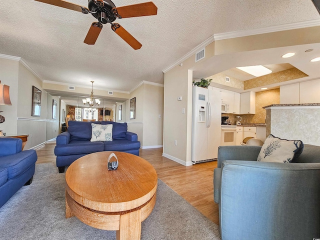 8560 Queensway Blvd Unit 508, Myrtle Beach, SC 29572 - living area featuring a chandelier, light wood-type flooring, a ceiling fan, a textured ceiling, and crown molding