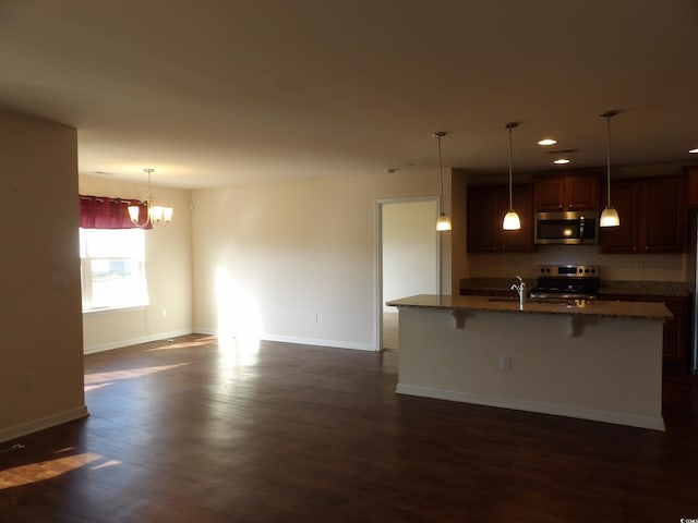 192 Mountain Ash Ln, Myrtle Beach, SC 29579 - kitchen with appliances with stainless steel finishes, a kitchen breakfast bar, dark wood-style floors, and recessed lighting