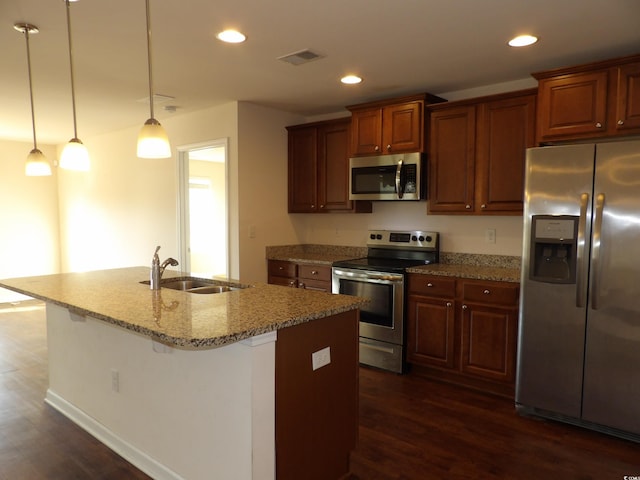192 Mountain Ash Ln, Myrtle Beach, SC 29579 - kitchen with stainless steel appliances, a sink, dark wood-type flooring, recessed lighting, and light stone countertops