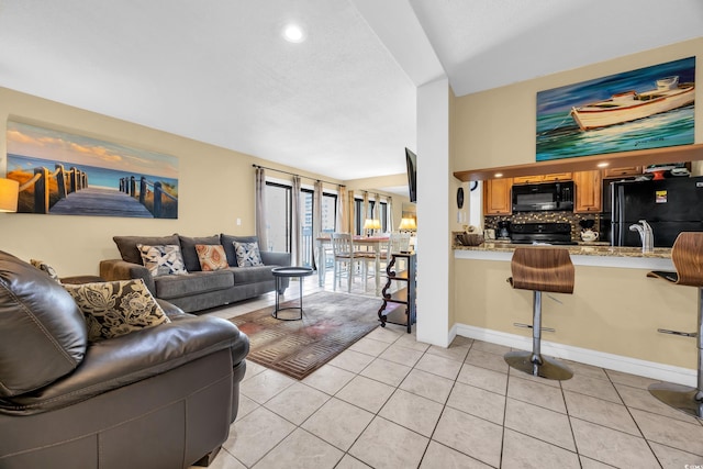 9661 Shore Dr Unit A1, Myrtle Beach, SC 29572 - living area featuring light tile patterned floors and recessed lighting