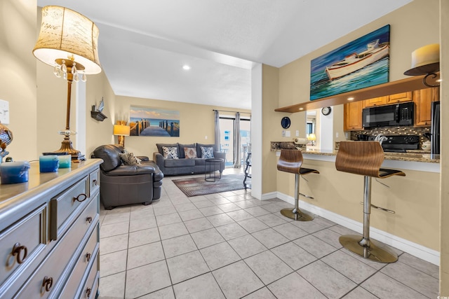 9661 Shore Dr Unit A1, Myrtle Beach, SC 29572 - living room featuring light tile patterned floors and recessed lighting