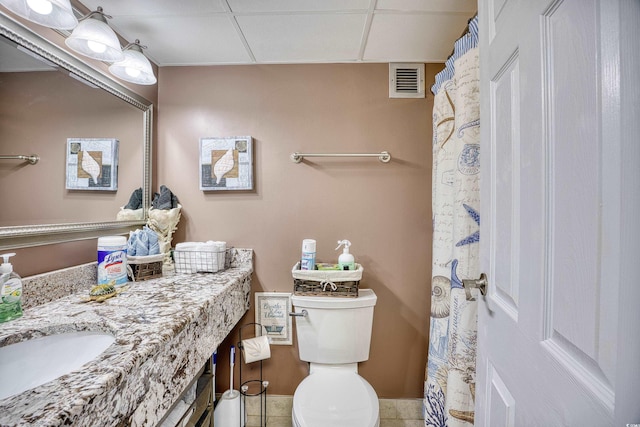 201 74th Ave N Unit 2241, Myrtle Beach, SC 29572 - bathroom featuring toilet, vanity, tile patterned flooring, and a drop ceiling