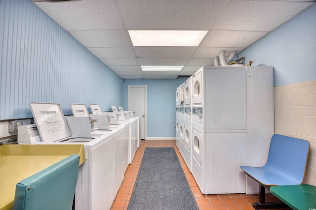 201 74th Ave N Unit 2241, Myrtle Beach, SC 29572 - communal laundry room with washing machine and dryer, stacked washing machine and dryer, and light tile patterned flooring