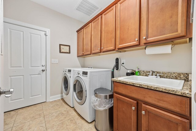 310 Babylon Pine Dr, Myrtle Beach, SC 29579 - washroom featuring washing machine and clothes dryer, cabinet space, light tile patterned floors, and baseboards