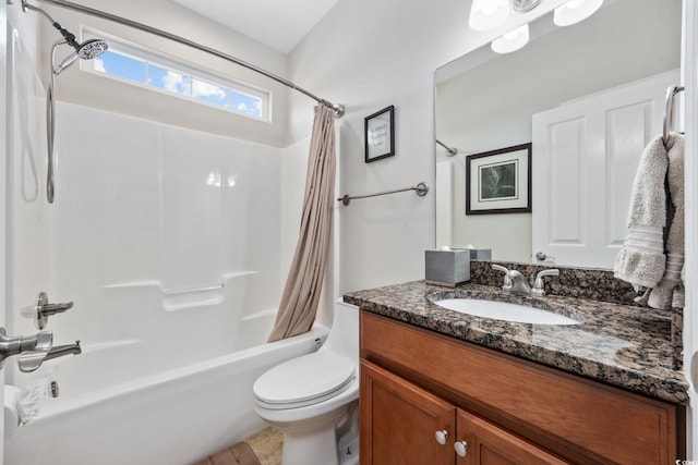 full bathroom with shower / tub combo with curtain, vanity, and toilet