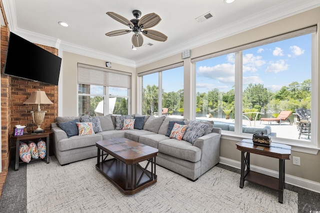 living area with baseboards, a ceiling fan, crown molding, recessed lighting, and view of scattered trees