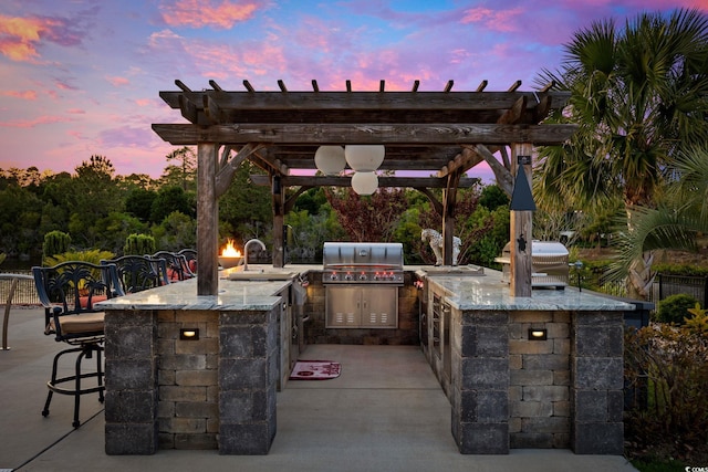 view of patio terrace at dusk
