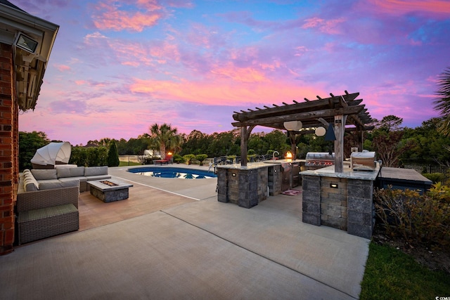 view of patio / terrace with a pergola, area for grilling, an outdoor pool, and an outdoor living space with a fire pit