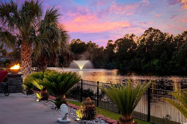 view of patio with a water view