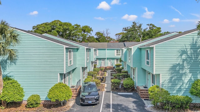 7403 N Ocean Blvd Unit C, Myrtle Beach, SC 29572 - view of property featuring uncovered parking