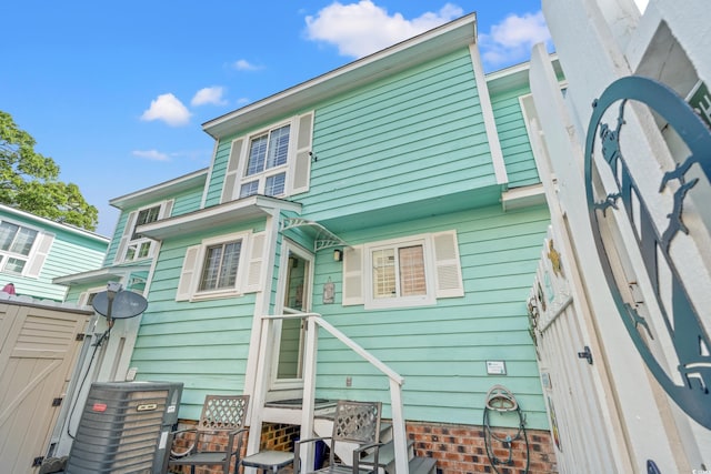 7403 N Ocean Blvd Unit C, Myrtle Beach, SC 29572 - back of house featuring central AC unit