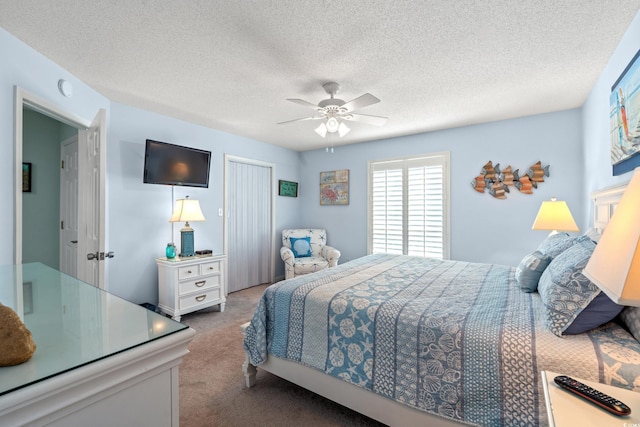 7403 N Ocean Blvd Unit C, Myrtle Beach, SC 29572 - bedroom with carpet, ceiling fan, a closet, and a textured ceiling