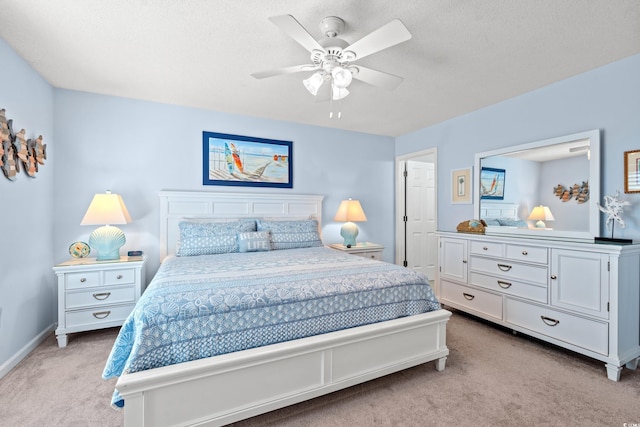 7403 N Ocean Blvd Unit C, Myrtle Beach, SC 29572 - bedroom with light carpet, baseboards, and a ceiling fan