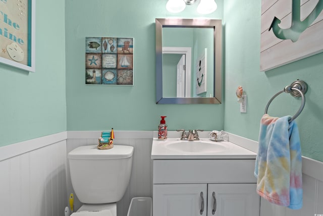 7403 N Ocean Blvd Unit C, Myrtle Beach, SC 29572 - bathroom featuring wainscoting, vanity, and toilet