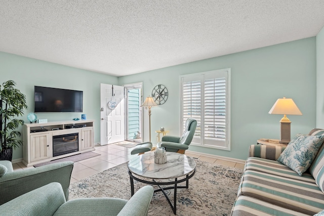 7403 N Ocean Blvd Unit C, Myrtle Beach, SC 29572 - living area with light tile patterned flooring, a textured ceiling, baseboards, and a glass covered fireplace
