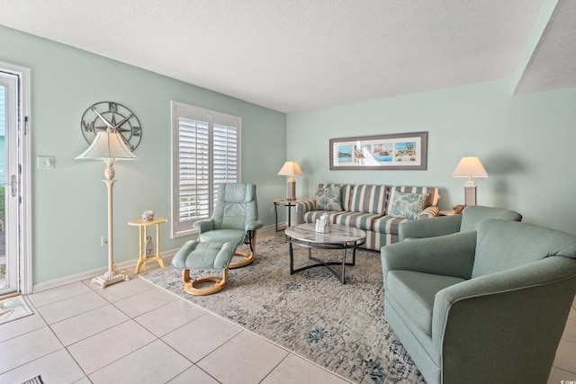 7403 N Ocean Blvd Unit C, Myrtle Beach, SC 29572 - living area with a textured ceiling, tile patterned flooring, and baseboards