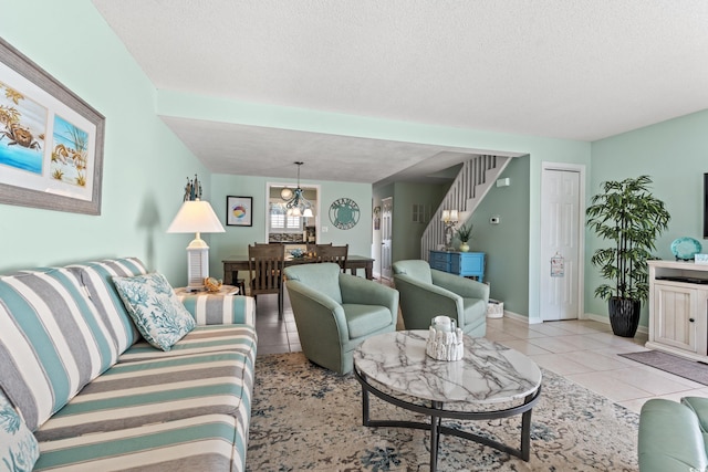 7403 N Ocean Blvd Unit C, Myrtle Beach, SC 29572 - living room featuring light tile patterned floors, stairs, baseboards, and a textured ceiling