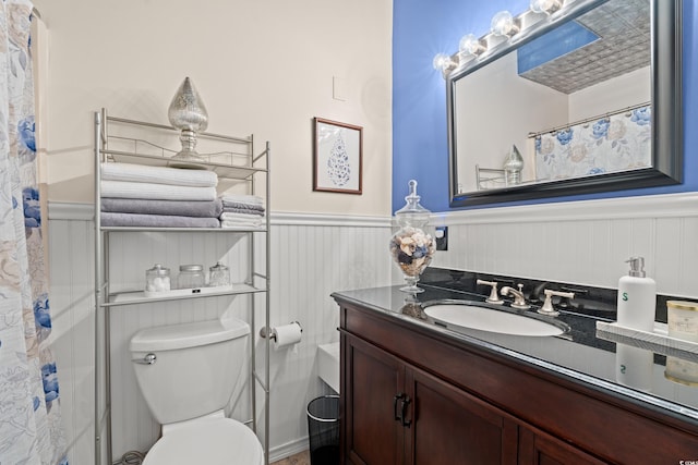 314 Lyons Cove Dr, Myrtle Beach, SC 29577 - bathroom featuring wainscoting, vanity, toilet, and a shower with shower curtain