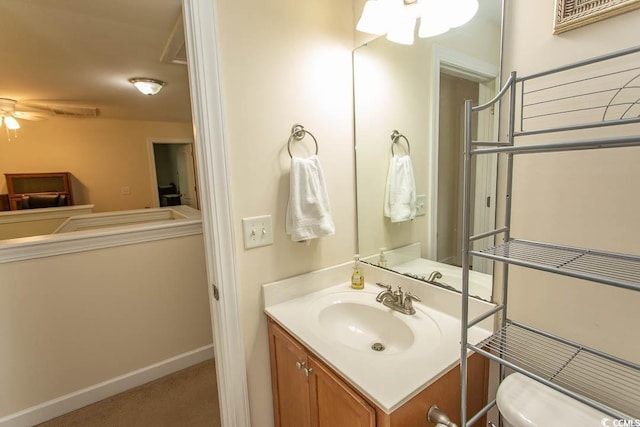 1028 Fairway Ln Unit 71, Conway, SC 29526 - half bath featuring a ceiling fan, toilet, vanity, and baseboards