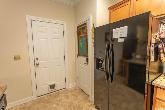 1028 Fairway Ln Unit 71, Conway, SC 29526 - kitchen with black fridge with ice dispenser, ornamental molding, baseboards, light stone countertops, and brown cabinetry