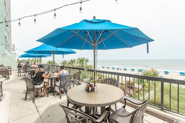 2401 S Ocean Blvd S Unit 1064, Myrtle Beach, SC 29577 - view of patio / terrace featuring outdoor dining space and view of water and beach