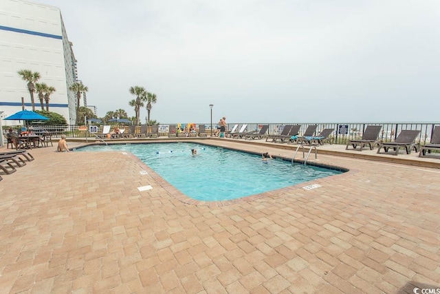 2401 S Ocean Blvd S Unit 1064, Myrtle Beach, SC 29577 - community pool featuring a patio