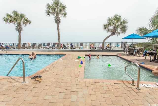 2401 S Ocean Blvd S Unit 1064, Myrtle Beach, SC 29577 - community pool featuring a patio