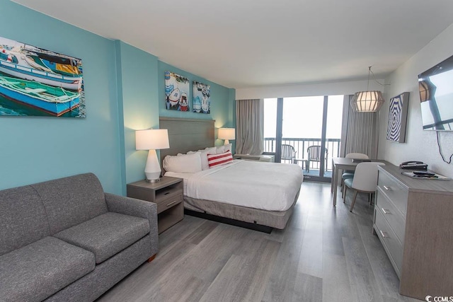 2401 S Ocean Blvd S Unit 1064, Myrtle Beach, SC 29577 - bedroom featuring wood finished floors and access to exterior