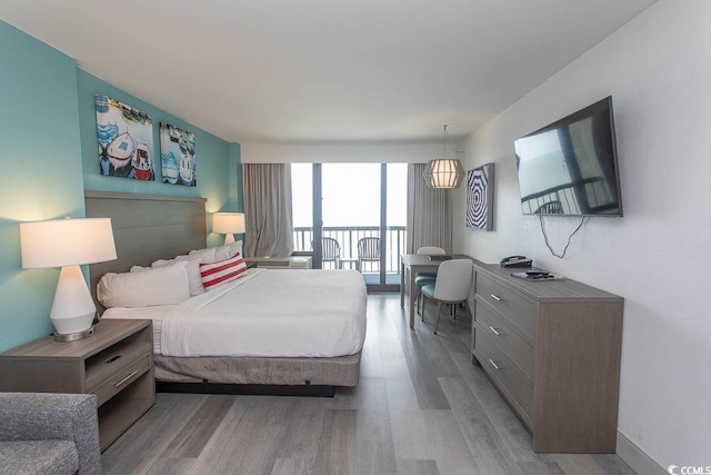2401 S Ocean Blvd S Unit 1064, Myrtle Beach, SC 29577 - bedroom with wood finished floors and access to exterior
