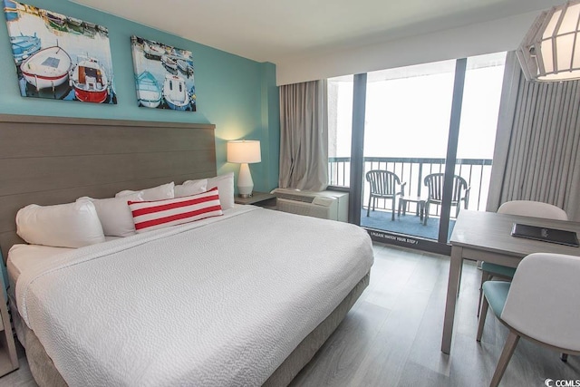 2401 S Ocean Blvd S Unit 1064, Myrtle Beach, SC 29577 - bedroom with access to exterior and wood finished floors