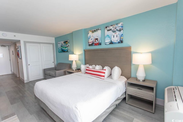 2401 S Ocean Blvd S Unit 1064, Myrtle Beach, SC 29577 - bedroom with wood finished floors, a closet, and baseboards