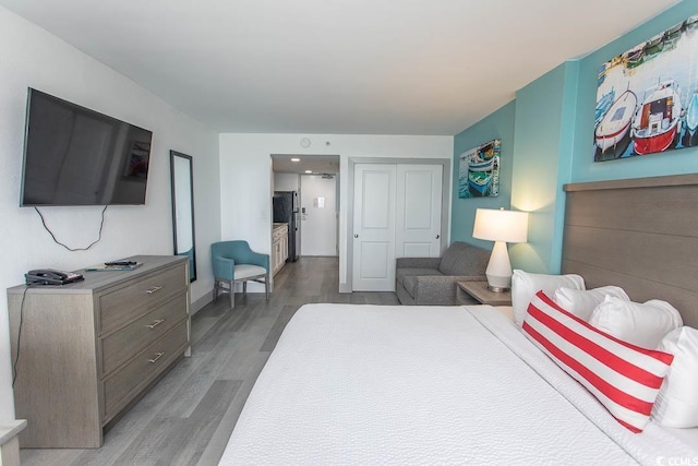 2401 S Ocean Blvd S Unit 1064, Myrtle Beach, SC 29577 - bedroom featuring wood finished floors, a closet, and baseboards