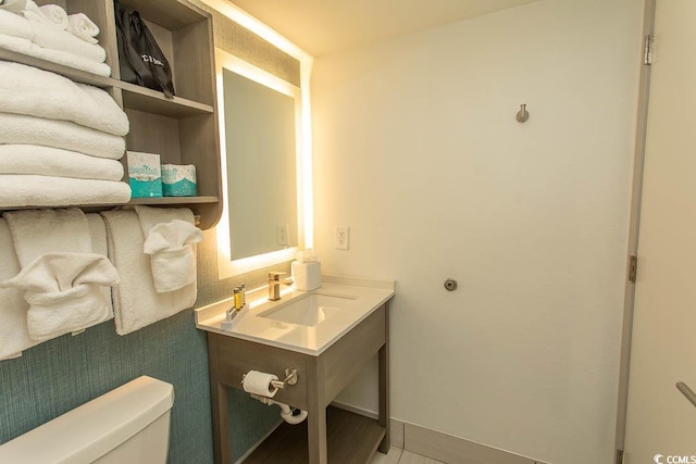 2401 S Ocean Blvd S Unit 1064, Myrtle Beach, SC 29577 - half bathroom featuring toilet, vanity, and baseboards