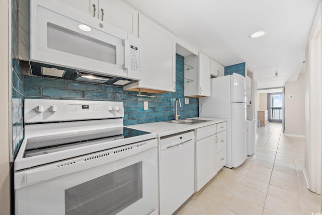 4000 N Ocean Blvd Unit 1002, North Myrtle Beach, SC 29582 - kitchen featuring white appliances, light tile patterned floors, a sink, white cabinetry, and recessed lighting