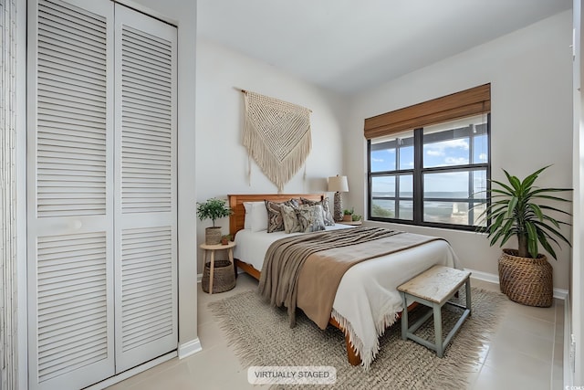 4000 N Ocean Blvd Unit 1002, North Myrtle Beach, SC 29582 - tiled bedroom featuring baseboards and a closet