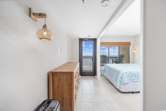 4000 N Ocean Blvd Unit 1002, North Myrtle Beach, SC 29582 - bedroom featuring access to outside and light tile patterned flooring