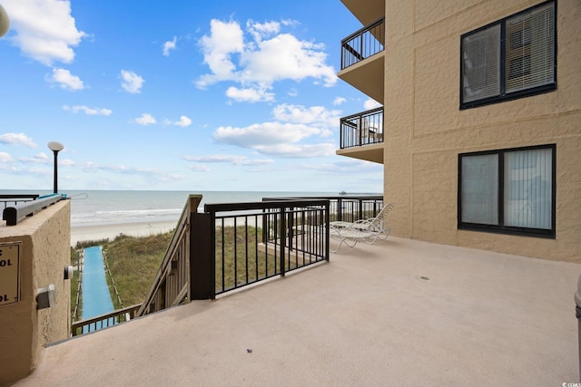 4000 N Ocean Blvd Unit 1002, North Myrtle Beach, SC 29582 - view of patio / terrace with a balcony and view of water and beach