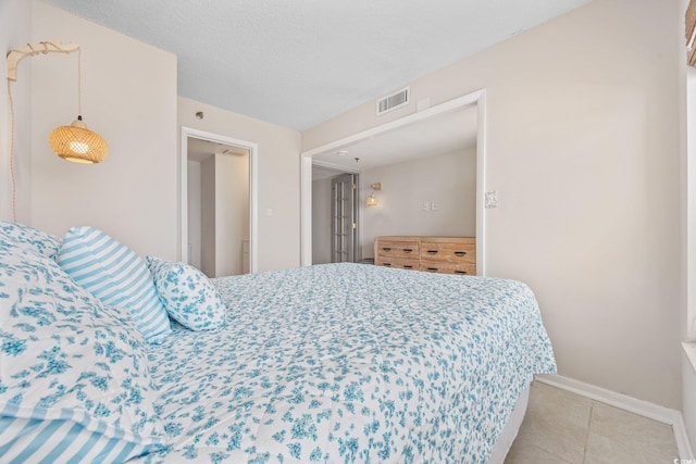 4000 N Ocean Blvd Unit 1002, North Myrtle Beach, SC 29582 - bedroom featuring baseboards and light tile patterned flooring