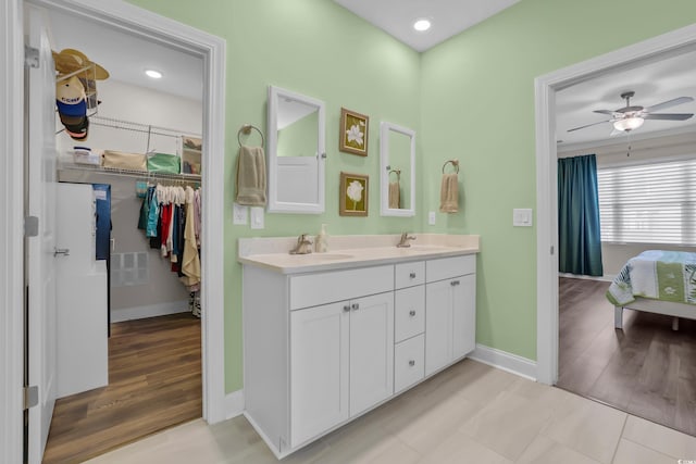 1012 Mary Read Dr, North Myrtle Beach, SC 29582 - full bath with baseboards, double vanity, a ceiling fan, and a spacious closet