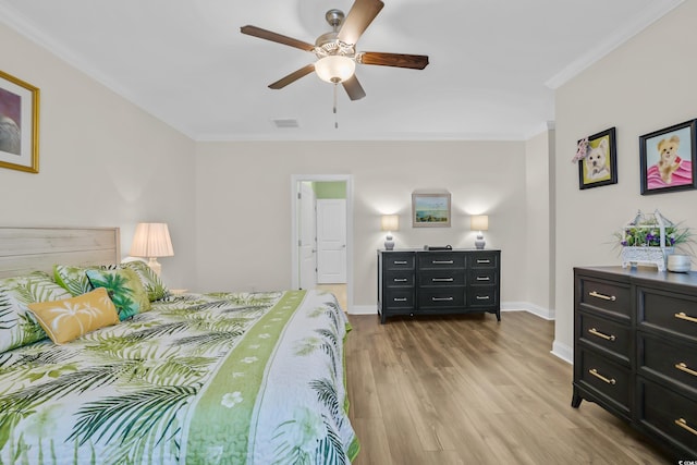 1012 Mary Read Dr, North Myrtle Beach, SC 29582 - bedroom with ornamental molding, wood finished floors, and a ceiling fan