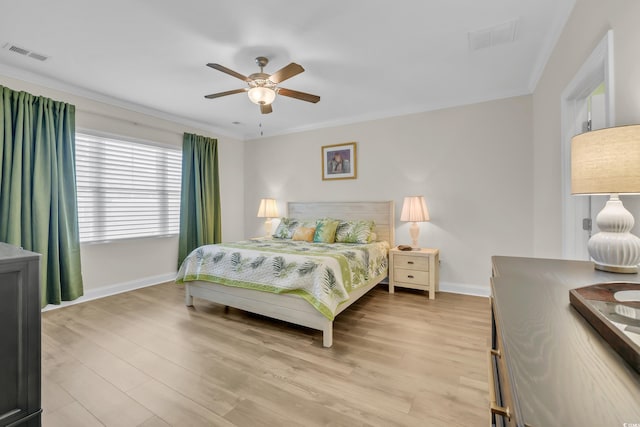 1012 Mary Read Dr, North Myrtle Beach, SC 29582 - bedroom with baseboards, light wood finished floors, ceiling fan, and ornamental molding
