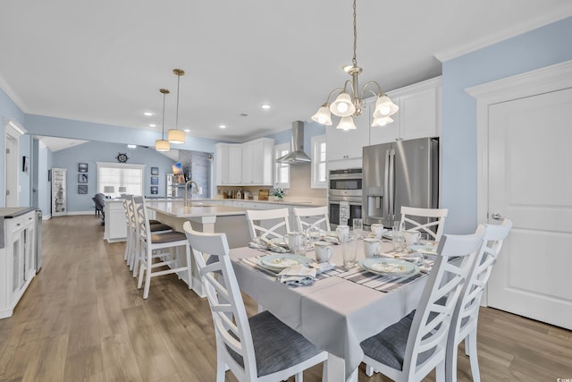 1012 Mary Read Dr, North Myrtle Beach, SC 29582 - dining area with light wood-style flooring, a chandelier, recessed lighting, and ornamental molding