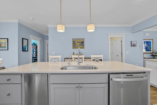 1012 Mary Read Dr, North Myrtle Beach, SC 29582 - kitchen featuring dishwasher, a sink, crown molding, pendant lighting, and wood finished floors