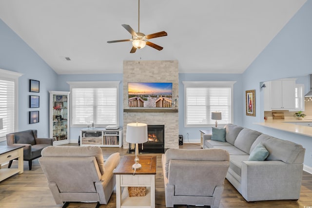 1012 Mary Read Dr, North Myrtle Beach, SC 29582 - living area featuring a ceiling fan, a fireplace, high vaulted ceiling, and wood finished floors