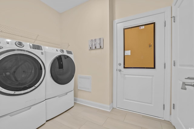 1012 Mary Read Dr, North Myrtle Beach, SC 29582 - laundry room with independent washer and dryer, baseboards, and light tile patterned floors