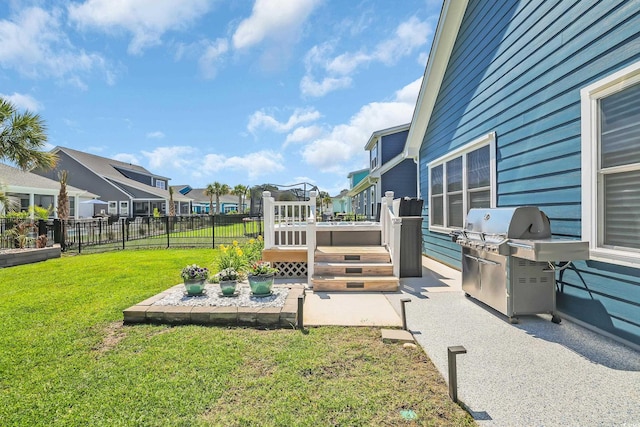 1012 Mary Read Dr, North Myrtle Beach, SC 29582 - view of yard featuring a deck, a residential view, and a patio area