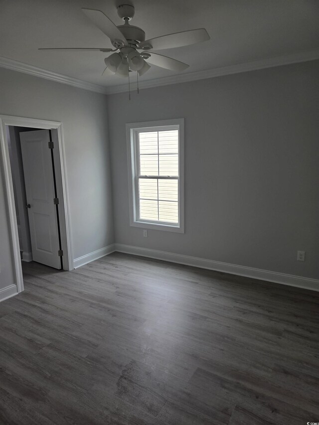 4823 Riverside Dr, North Myrtle Beach, SC 29582 - empty room with crown molding, baseboards, ceiling fan, and dark wood-style floors