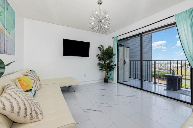 5905 S Kings Hwy Unit 344B, Myrtle Beach, SC 29575 - living room featuring marble look tile flooring, a chandelier, and baseboards