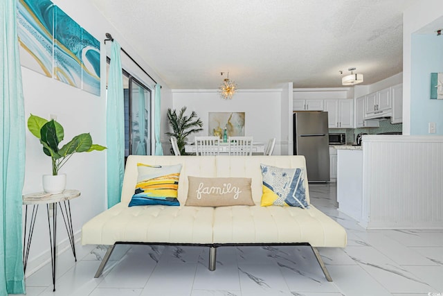 5905 S Kings Hwy Unit 344B, Myrtle Beach, SC 29575 - living room with a textured ceiling and light marble finish flooring